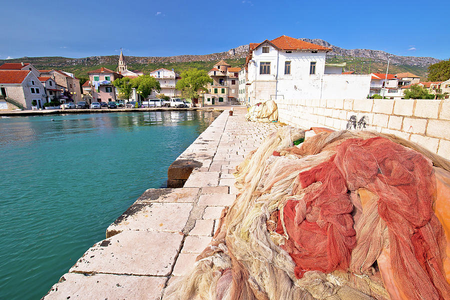 Fishing nets on dock in adriatic village of Kastel Kambelovac Photograph by Brch Photography