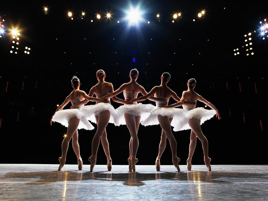 Five Ballerinas En Pointe On Stage Photograph by Thomas Barwick