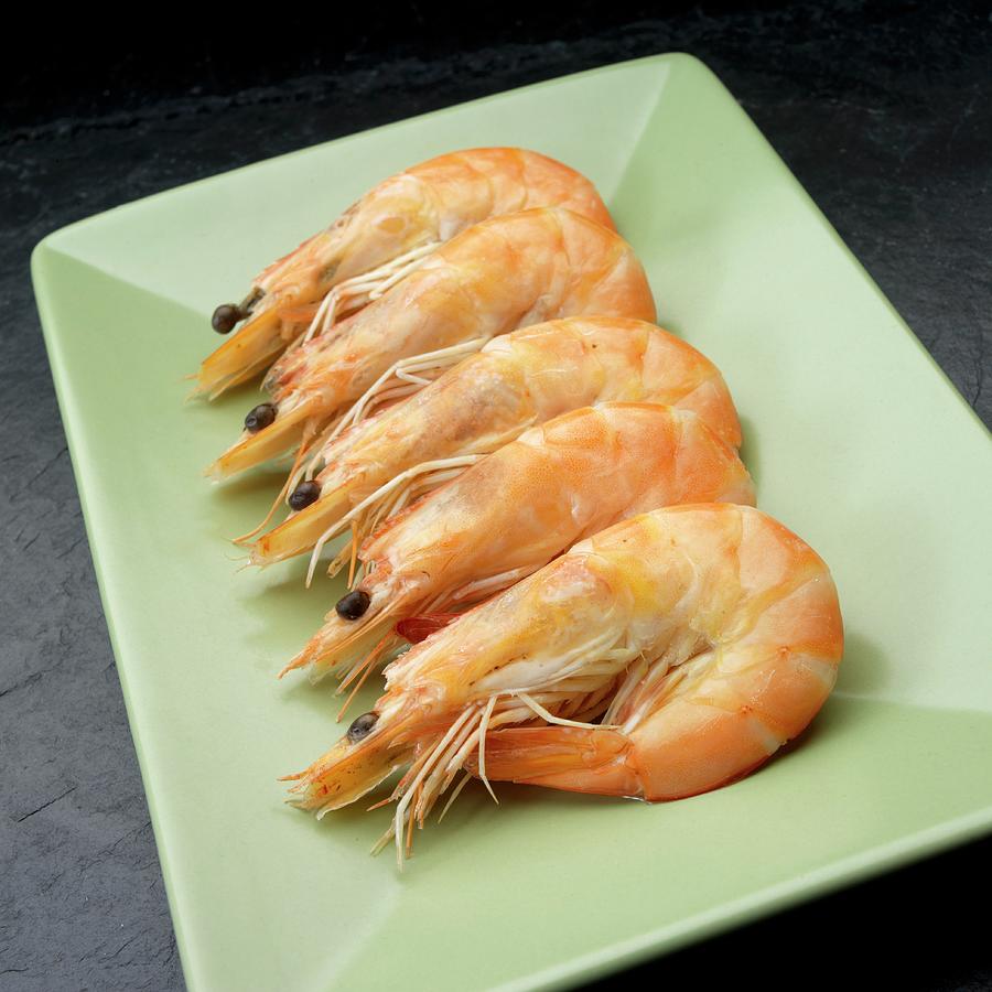 Five Boiled Prawns On A Serving Dish Photograph by Paul Poplis