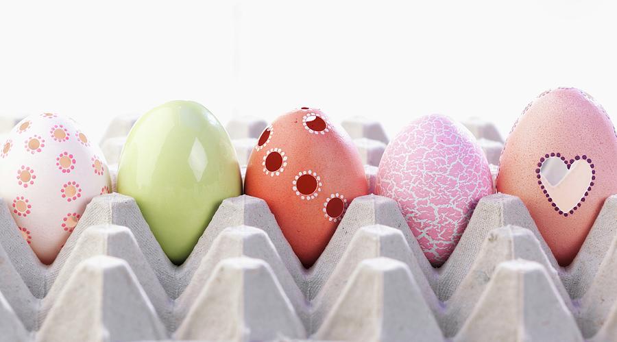 Five Different Decorated Easter Eggs In Egg Tray Photograph by Stephanie Gayer