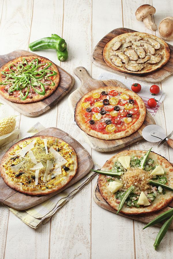 Five Different Vegetarian Pizzas On Wooden Boards Photograph by Yuichi Nishihata Photography