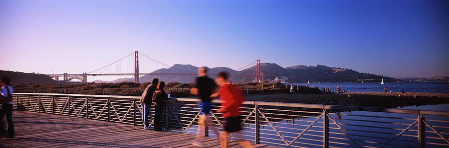 Golden Gate Bridge Photograph - Five People Jogging On A Bridge, Golden by Panoramic Images