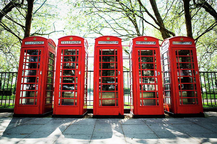 Five Red Telephone Boxes In A Line Photograph by Richard Boll