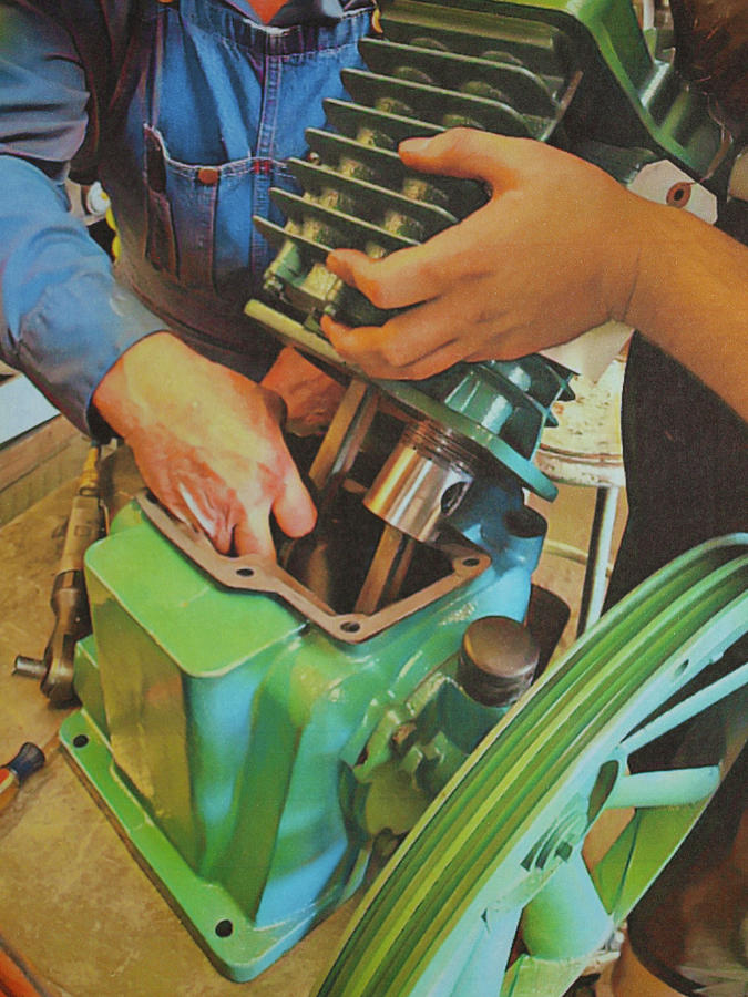 Fixing A Compressor Pump Photograph