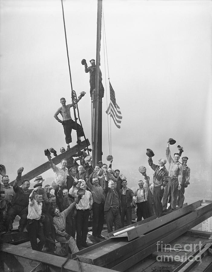 Flag Raising At Rockefeller Building Photograph by Bettmann