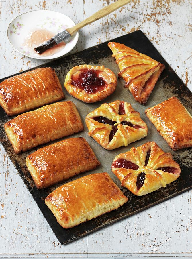 Flaky Pastry Jam Turnovers On A Baking Tray Photograph by Nicolas Leser