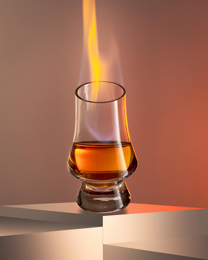 Flame In The Glass Of Liquor Photograph by Konstantin Morozov