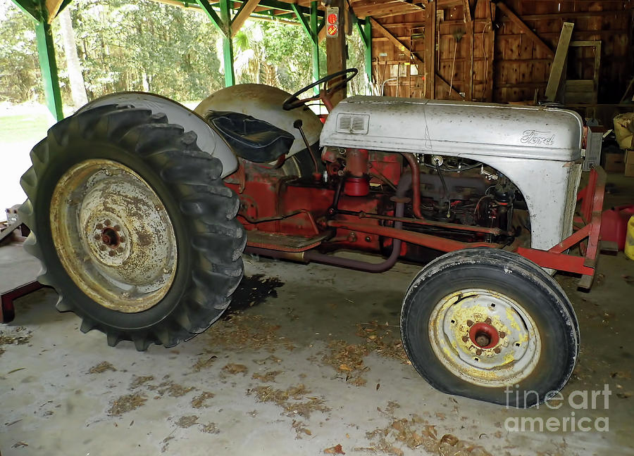 Flat Tire On The Ford Tractor Photograph by D Hackett