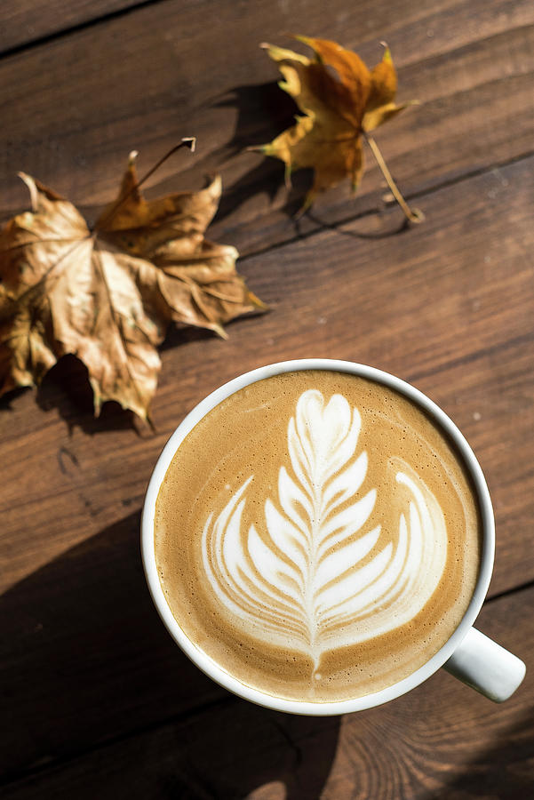 Flat White, Cappuccino Coffee With Rosetta Or Florette Latte Art On A Wooden Background With Autumn Leaves Photograph by Giulia Verdinelli Photography