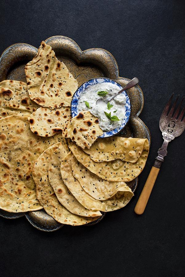 Flatbread With Black Onion Seeds And Cucumber Raita Photograph by Magdalena Hendey