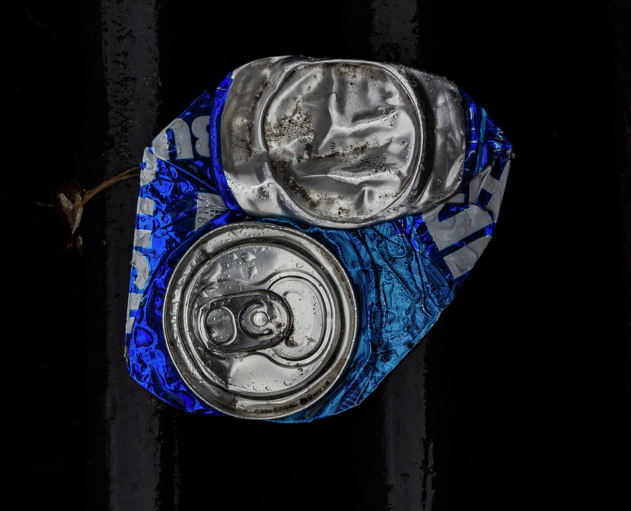 Flattened Can and Raindrops Photograph by Robert Ullmann