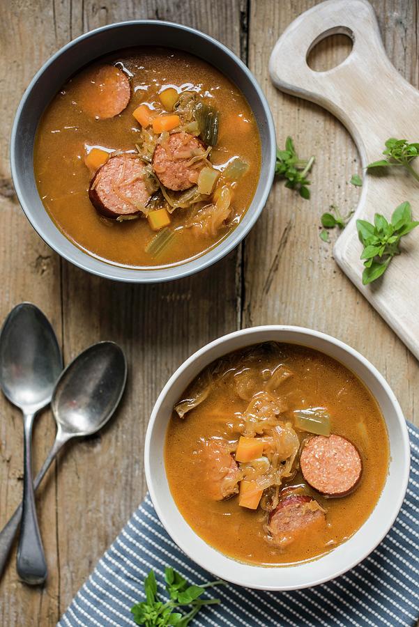 Flavoursome Sauerkraut Cabbage Soup With Smoked Sausage seen From Above Photograph by Magdalena Hendey