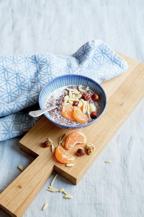 Flaxseed Pudding With Nuts And Tangerines Photograph by Claudia Timmann