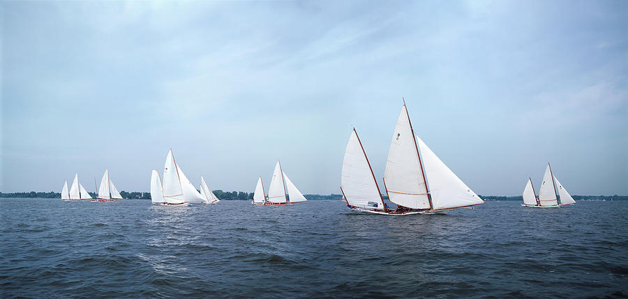 Fleet Of Sailing Log Canoes Racing Photograph by Greg Pease