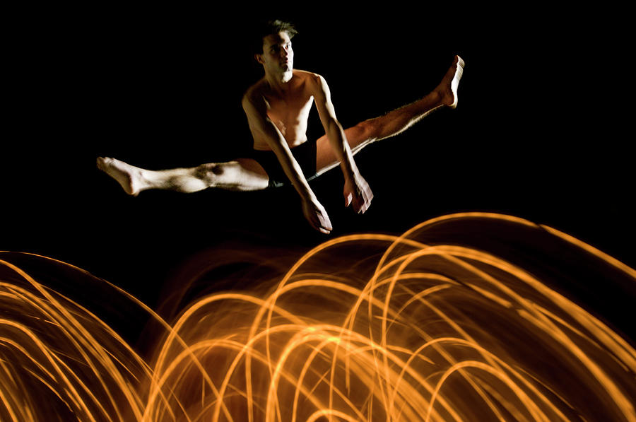Flexible Dancer  Jumps Over Abstract Photograph by John Rensten