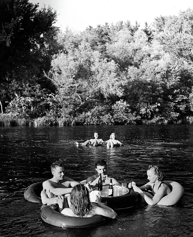 Nature Photograph - Floating in Inner Tubes by Alfred Eisenstaedt