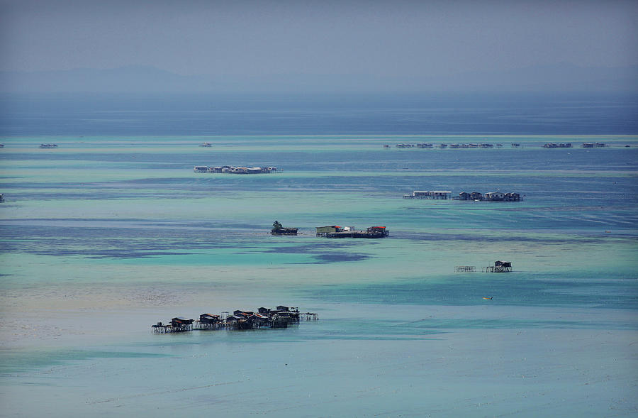 Floating Villages On A Coral Reef In Photograph by Timothy Allen