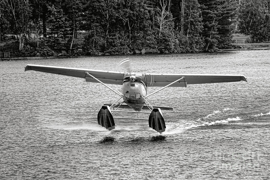 Floatplane Taking Off on a Maine Lake Photograph by Olivier Le Queinec