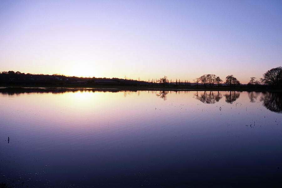 Flooded Water Meadow at sunset Photograph by Nicholas Henfrey
