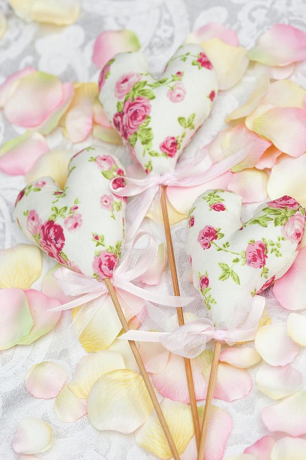 Floral, Fabric Love-hearts On Wooden Sticks As Wedding Decorations Photograph by Jasmine Burgess