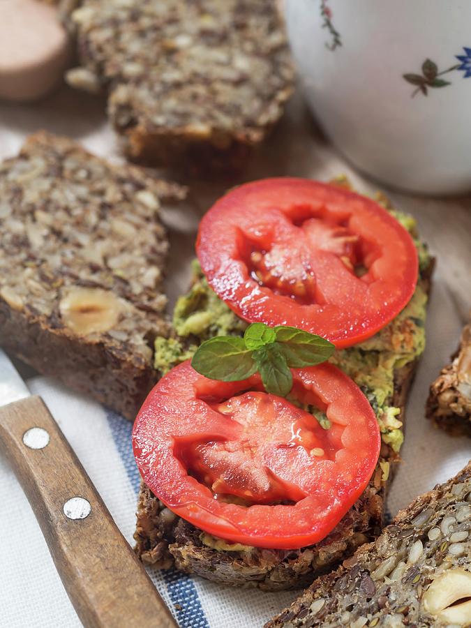 Flourless Bread With Sunflower, Flax And Chia Seeds, Oats, Psyllium Seed Husks And Hazelnuts, Served With Pesto And Fresh Tomatoes Photograph by Magdalena Paluchowska
