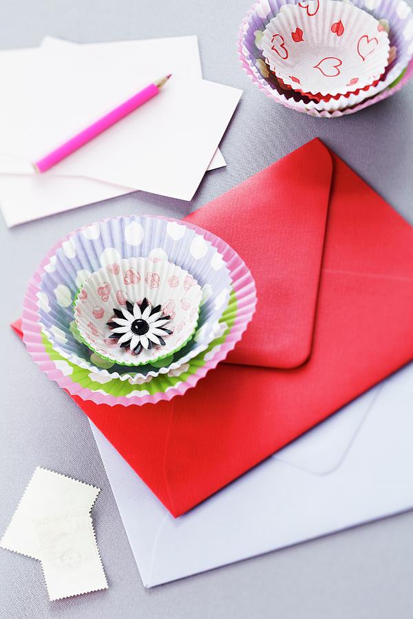 Flower Decoration Made From Paper Cake Cases On Envelope Photograph by Franziska Taube