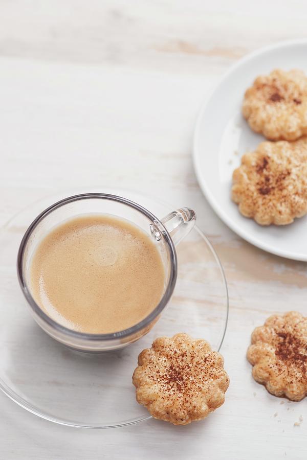 Flower-shaped Biscuits With Cocoa Powder Served With A Cup Of Coffee Photograph by Laurange