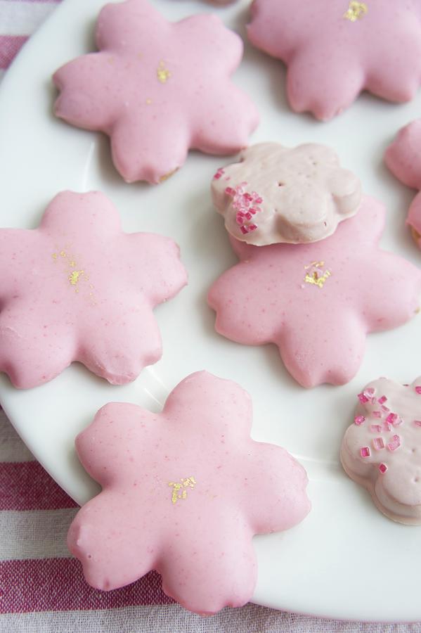 Flower-shaped Biscuits With Pink Icing On Plate Photograph by Martina Schindler