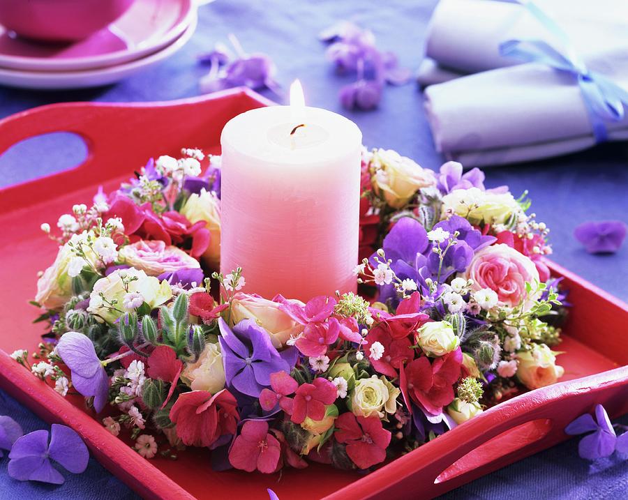 Flower Wreath Around Pink Candle On Tray Photograph by Friedrich Strauss