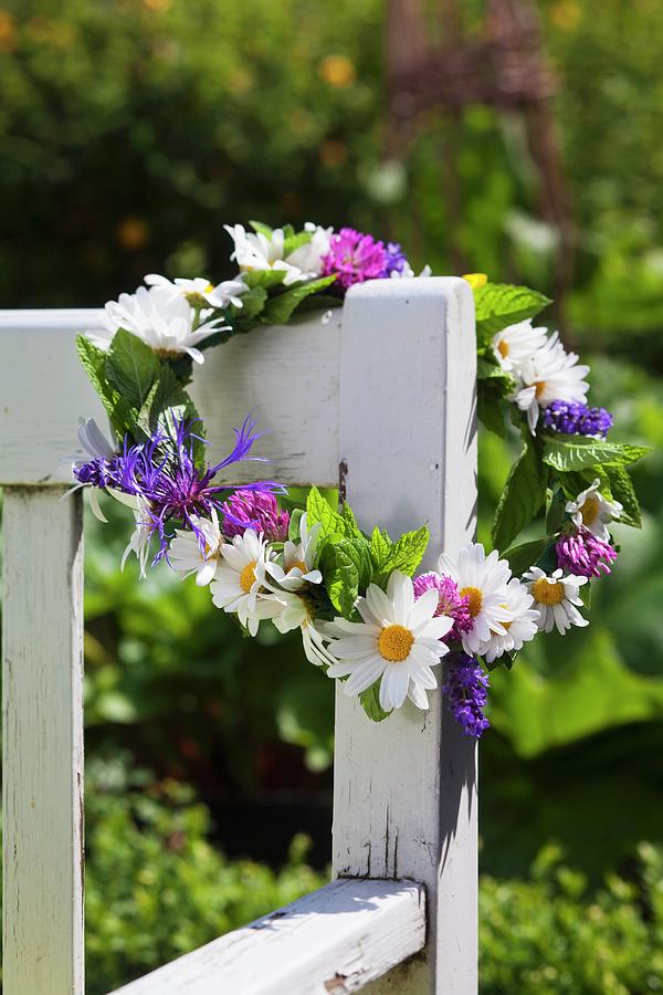 Flower Wreath With Daisies On A Garden Bench Photograph by Per Magnus Persson