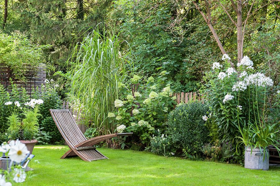Flowerbeds And Lawn In Idyllic Garden Photograph by Piru-pictures