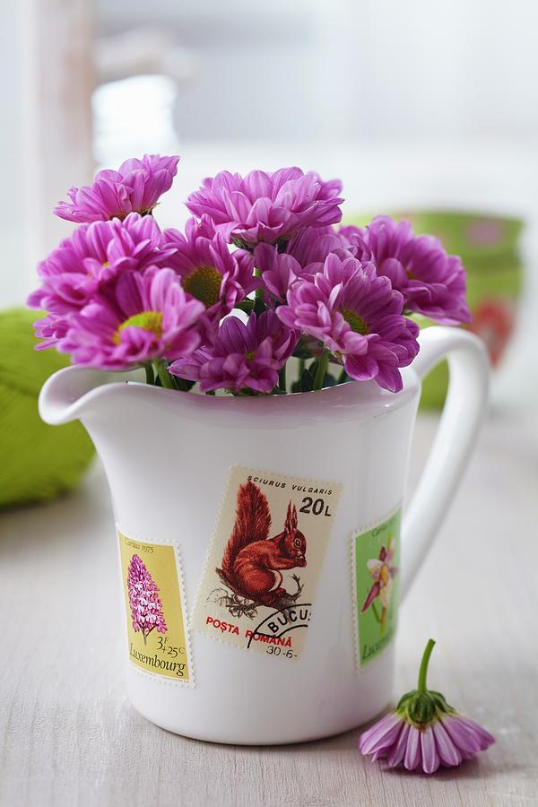 Flowers In Jug Decorated With Postage Stamps Photograph by Franziska Taube