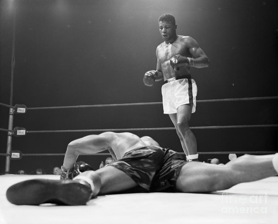 Floyd Patterson Standing Above Archie Photograph by Bettmann