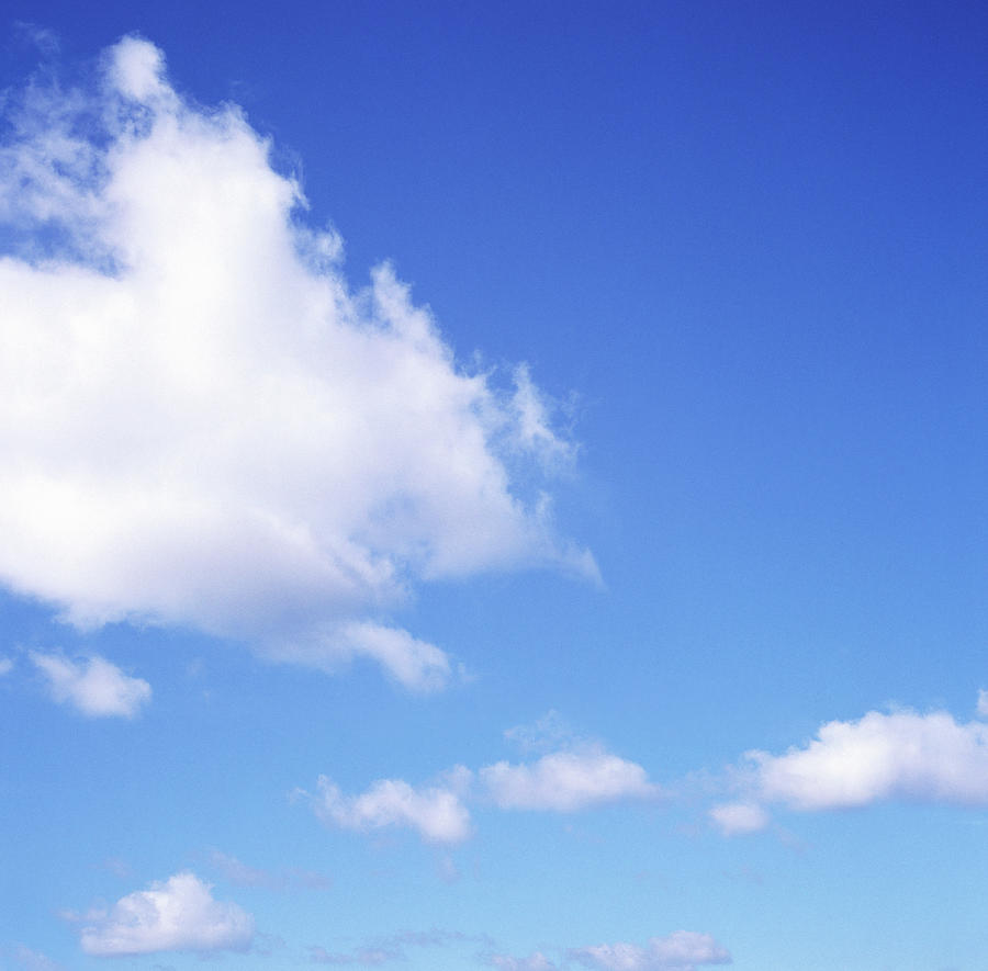 Fluffy Cloud In Blue Sky Photograph by Dougal Waters