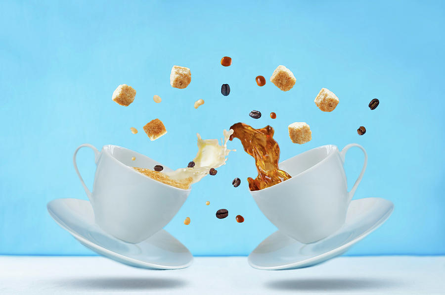 Flying Cups Of Coffee With Sugar And Coffee Beans On A Blue Background Photograph by Natasha Arz