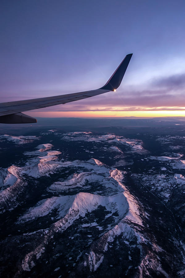 Flying over colorado rocky mountains at sunset Photograph by Alex Grichenko