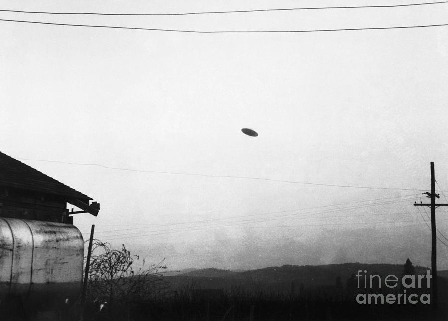 Flying Saucer Flying Over Farm Photograph by Bettmann