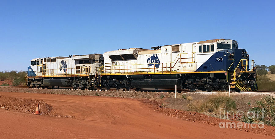 Desert Photograph - FMG is a private rail network in the Pilbara region of Western Australia built to carry iron ore by Roy Jacob