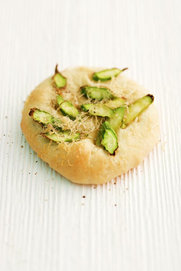 Focaccia With Green Asparagus And Parmesan On A Wooden Surface Photograph by Michael Wissing