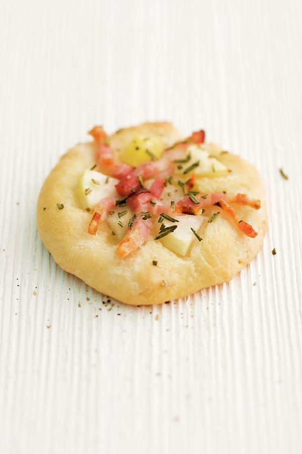 Focaccia With Pears, Bacon And Rosemary On A Wooden Surface Photograph by Michael Wissing