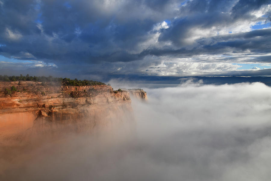 Fog Rises to Rim Rock Drive in Fruita Canyon Photograph by Ray Mathis