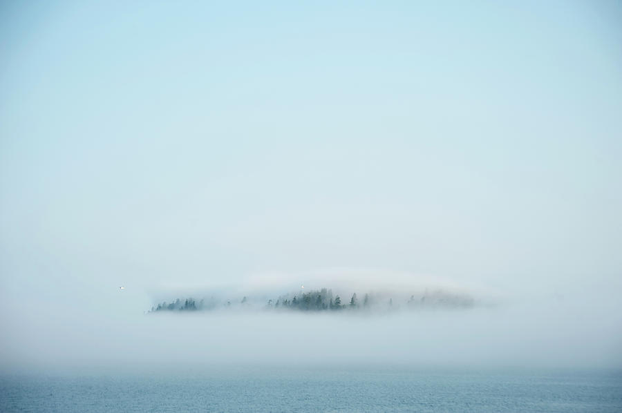 Fog Shrouds Blake Island On Puget Photograph by Aaron Mccoy