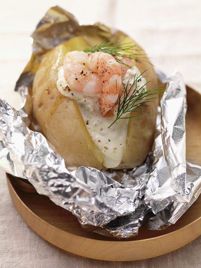 Foil-wrapped Baked Potato With Prawns And Sour Cream Photograph by Eising Studio - Food Photo & Video