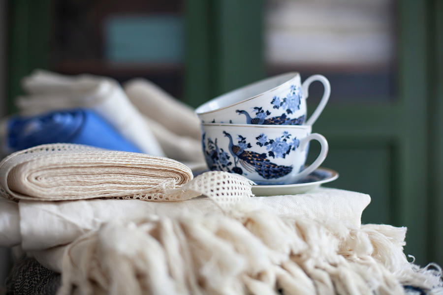 Coffee Photograph - Folded Tablecloths And Blue-and-white Cups by Alicja Koll