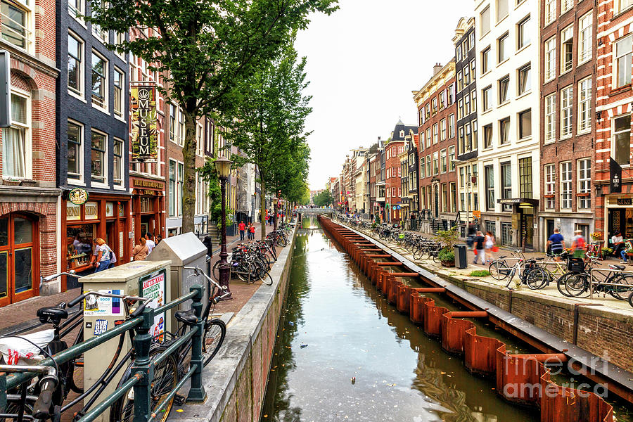 Follow the Canal Water in Amsterdam Photograph by John Rizzuto