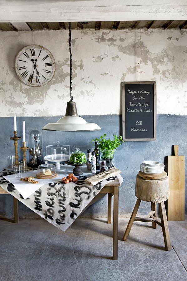Food And Kitchen Utensils Under Glass Covers On Vintage Table Against Rustic, Blue And White Wall Photograph by Annette Nordstrom
