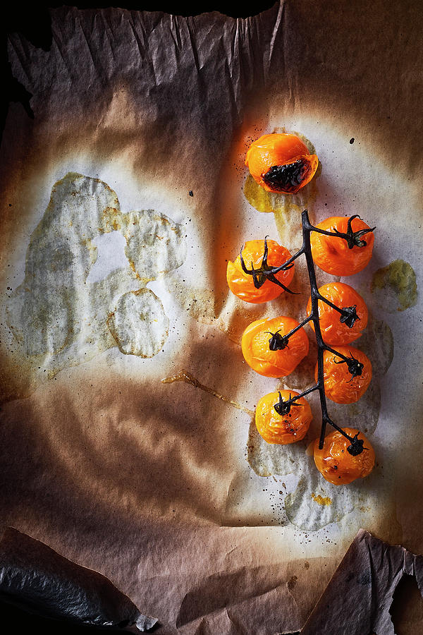 Food Art: Baked Vine Tomato On A Baking Paper Photograph by Manfred Rave