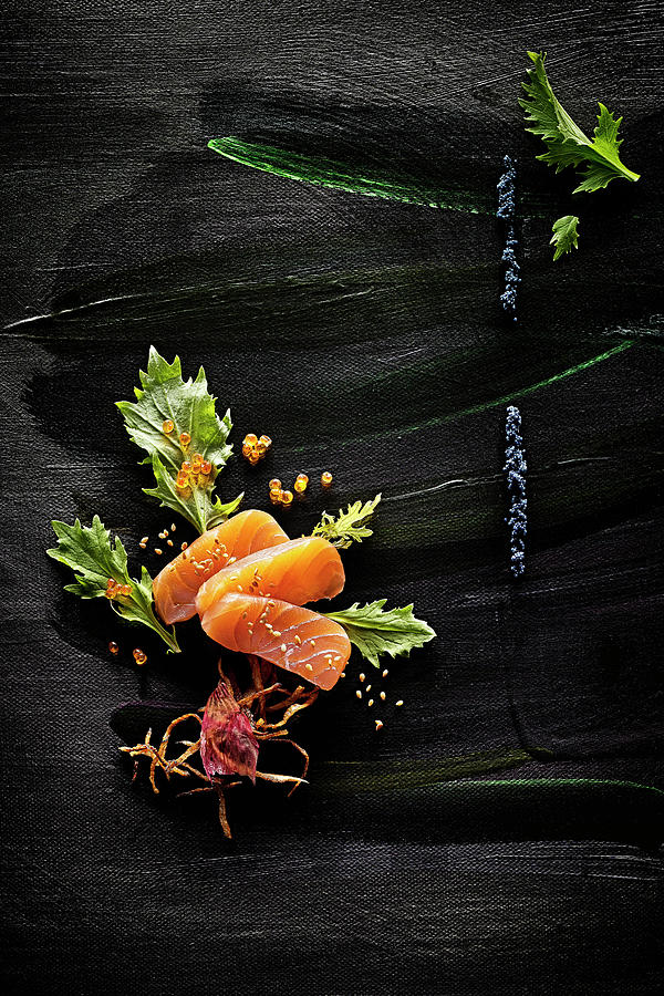 Food Art: Salmon With Caviar, Celery, Roasted Onions And Sesame Seeds On A Black Painted Surface Photograph by Manfred Rave
