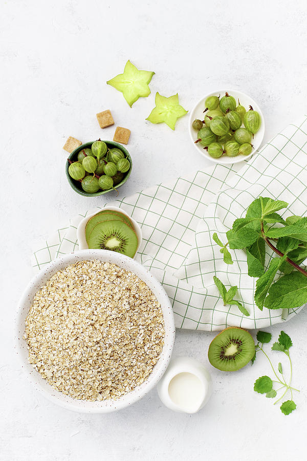 Food Composition With Oats, Kiwi, Gooseberries And Mint Photograph by Asya Nurullina