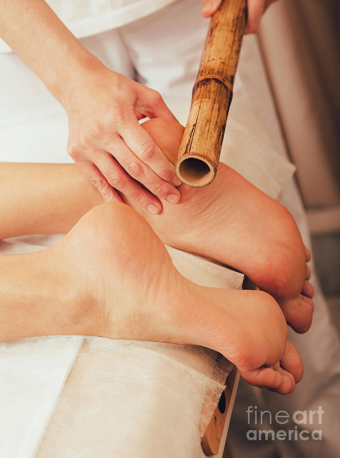 Foot Massage With Bamboo Sticks Photograph by Science Photo Library Foot Massage With Bamboo Sticks Photograph by Science Photo Library